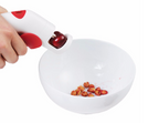Cherry pitter in use