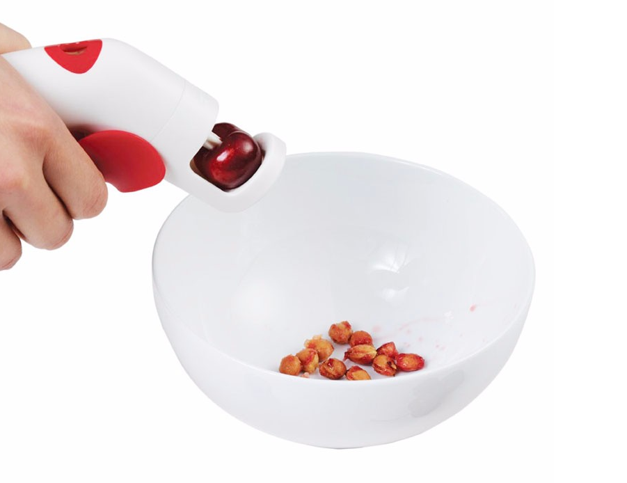Cherry pitter in use
