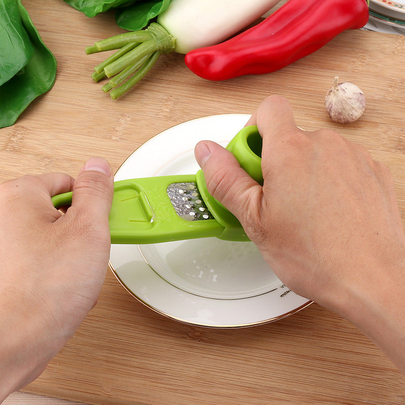 Garlic masher in use