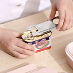 Corkscrew and bottle opener in use